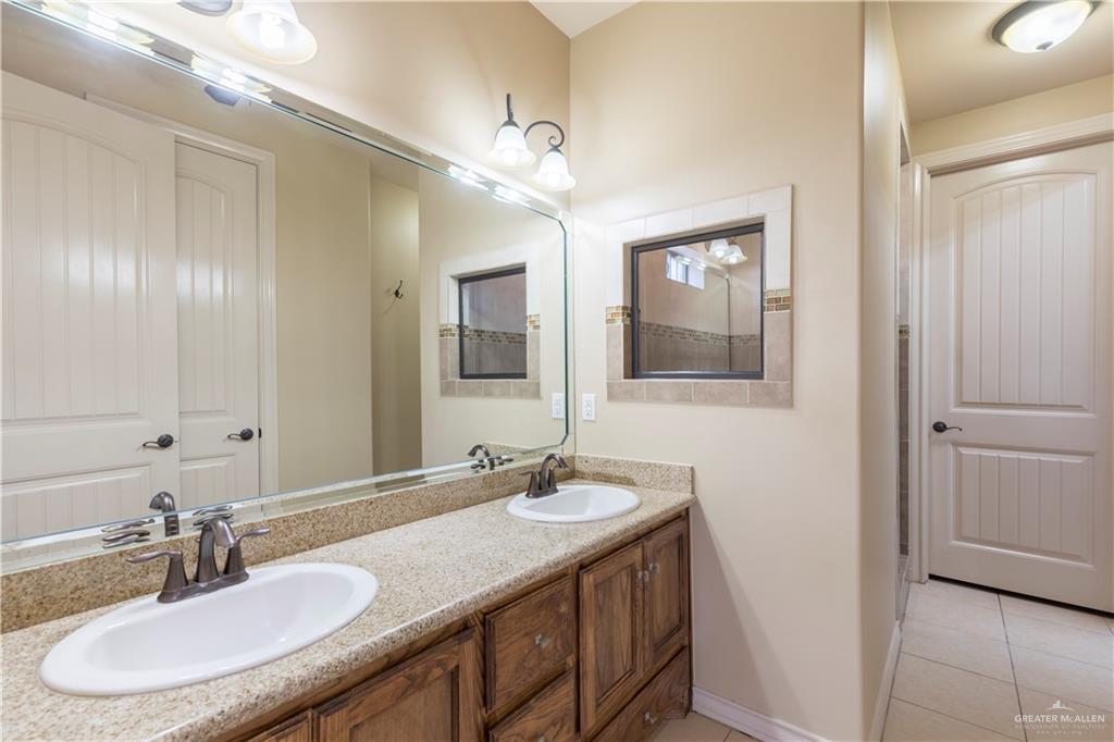 4212 Toronto Avenue McAllen, TX 78503 - Photo 9 of 15 a bathroom with a sink double vanity and a mirror
