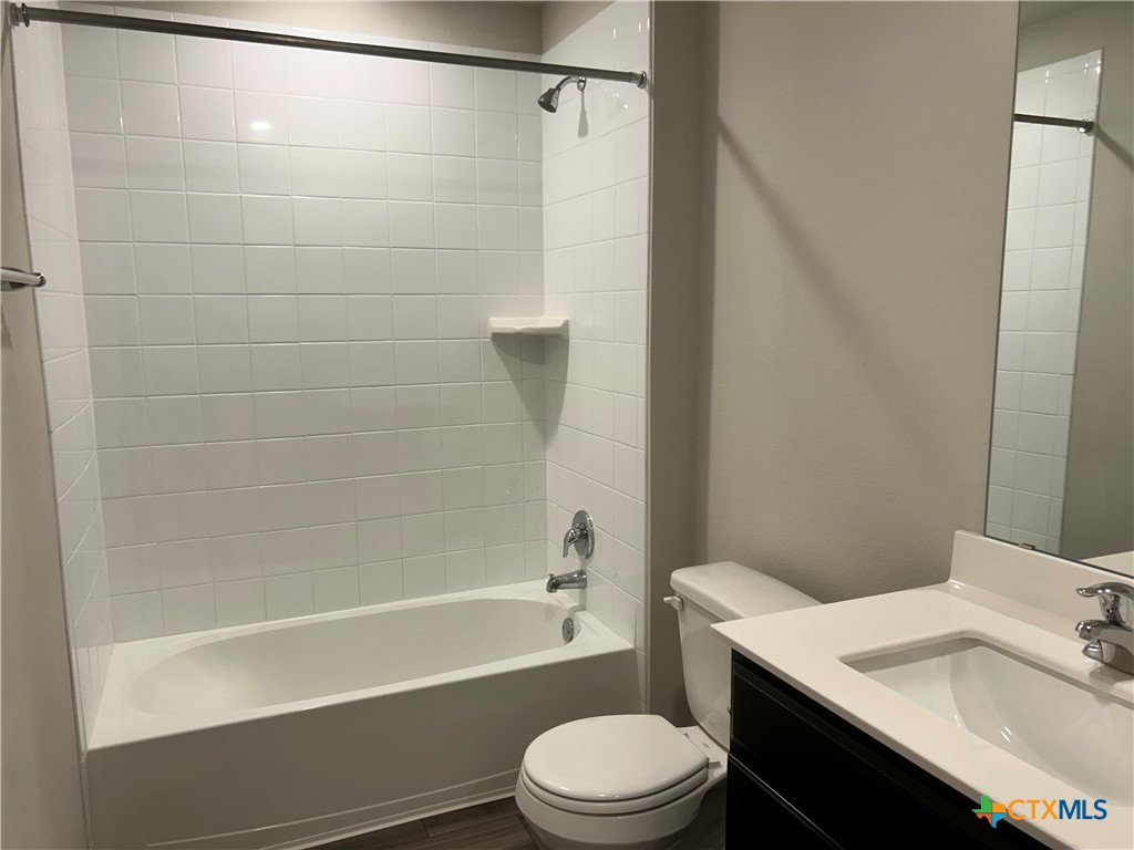 8419 Brahma Plns Road Temple, TX 76502 - Photo 15 of 17 a bathroom with a sink a toilet and shower