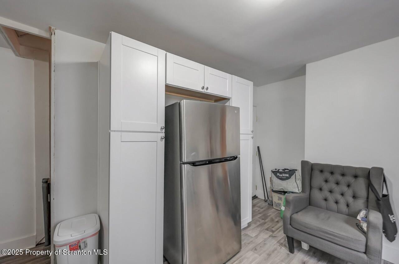 317-319 10th Avenue Scranton, PA 18504 - Photo 17 of 64 a refrigerator freezer sitting in a kitchen
