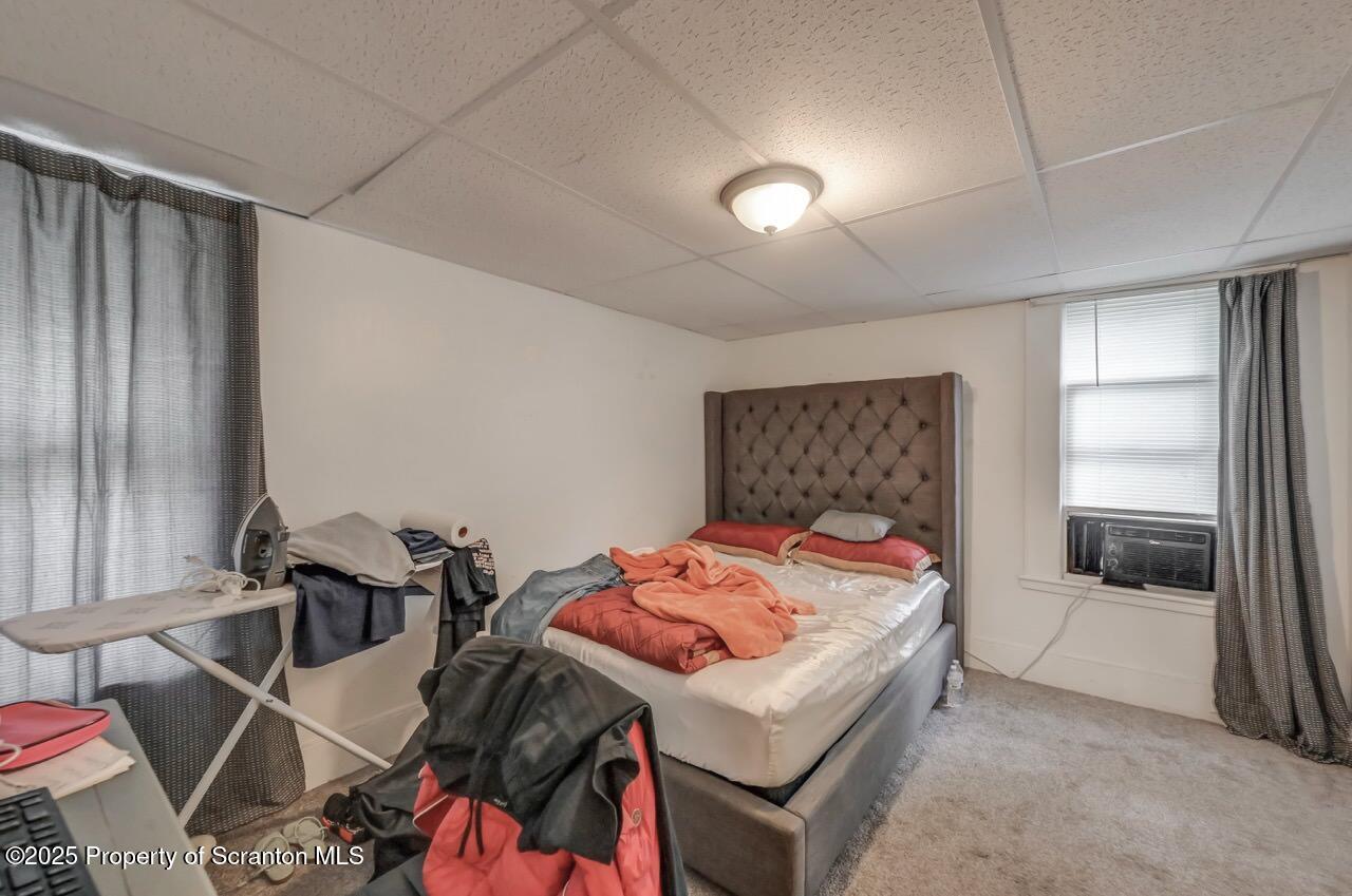317-319 10th Avenue Scranton, PA 18504 - Photo 18 of 64 a bedroom with a bed and a table