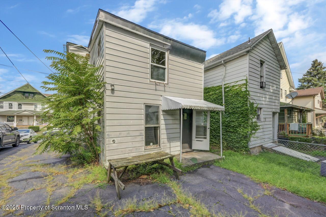 317-319 10th Avenue Scranton, PA 18504 - Photo 2 of 64 a view of a house with a yard and sitting area