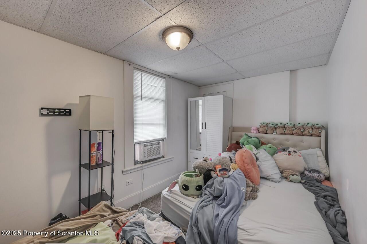 317-319 10th Avenue Scranton, PA 18504 - Photo 22 of 64 a bed room with a bed and a window