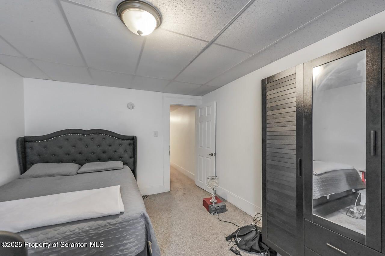 317-319 10th Avenue Scranton, PA 18504 - Photo 24 of 64 a living room with furniture and a window