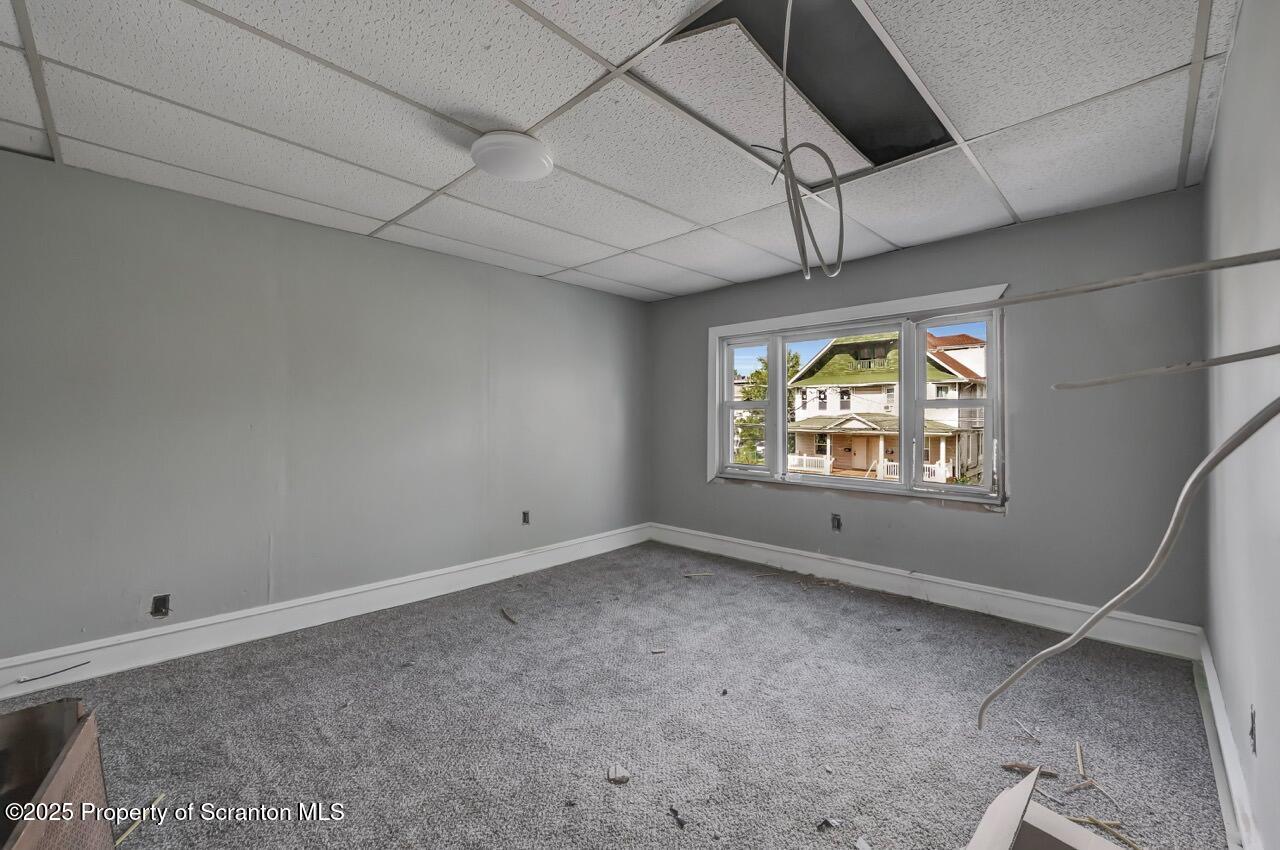 317-319 10th Avenue Scranton, PA 18504 - Photo 30 of 64 a view of an empty room with a window