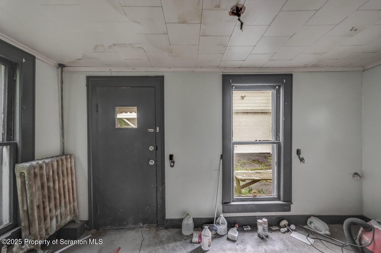 317-319 10th Avenue Scranton, PA 18504 - Photo 36 of 64 a bathroom with a sink and a mirror