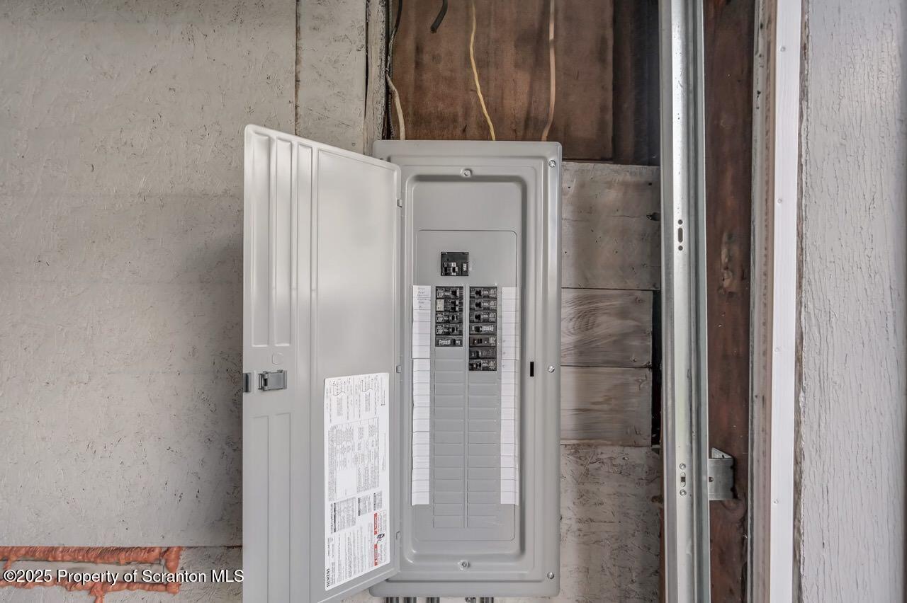 317-319 10th Avenue Scranton, PA 18504 - Photo 40 of 64 a bathroom with a shower and a mirror