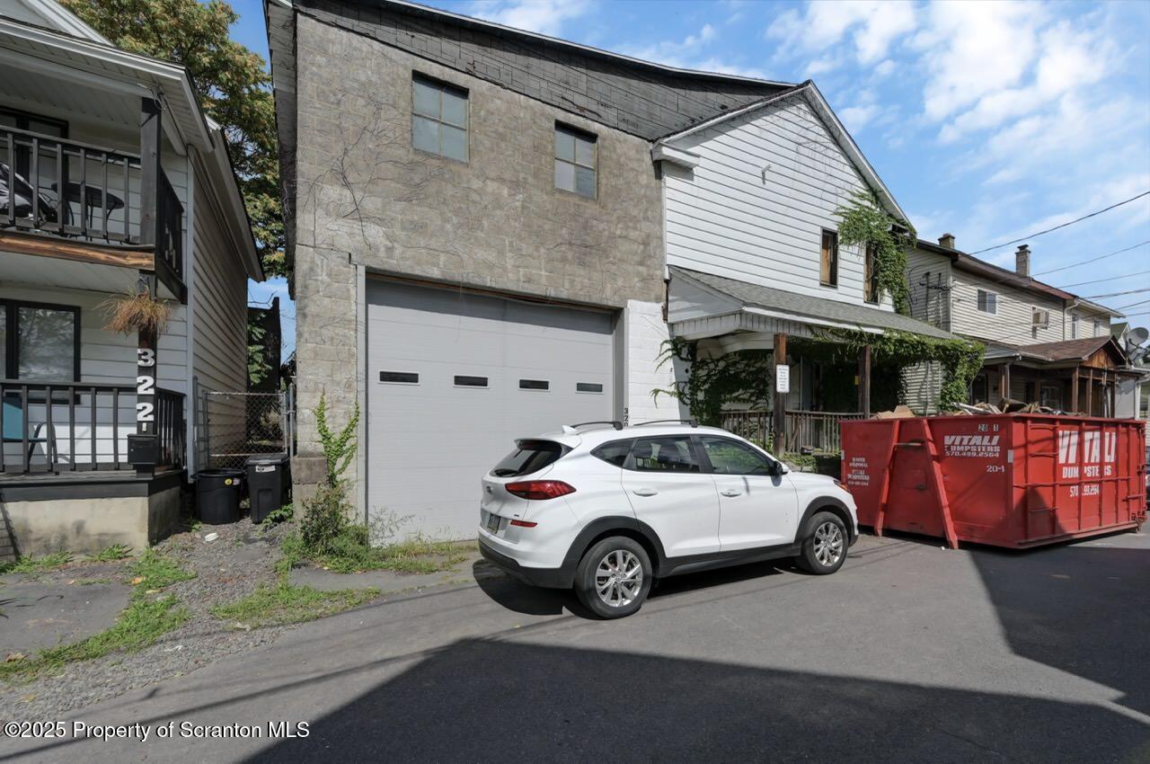 317-319 10th Avenue Scranton, PA 18504 - Photo 53 of 64 a view of a car parked in front of a house