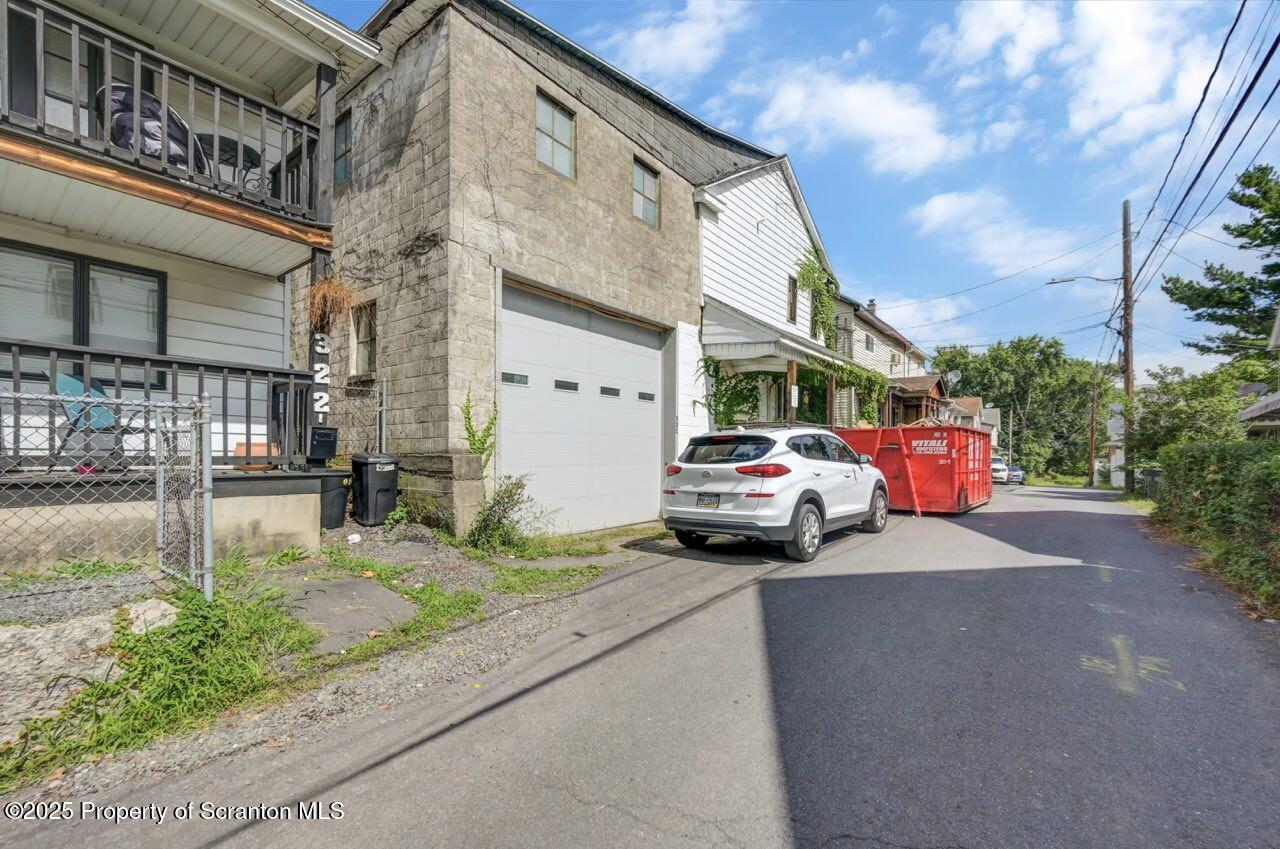 317-319 10th Avenue Scranton, PA 18504 - Photo 63 of 64 a car parked in front of brick building