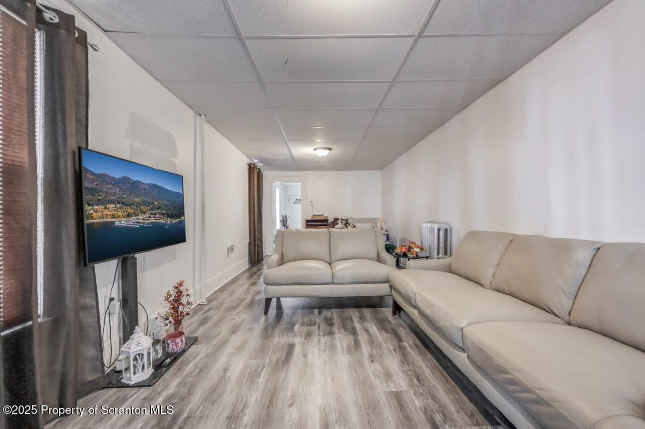 317-319 10th Avenue Scranton, PA 18504 - Photo 8 of 64 a living room with furniture and a flat screen tv