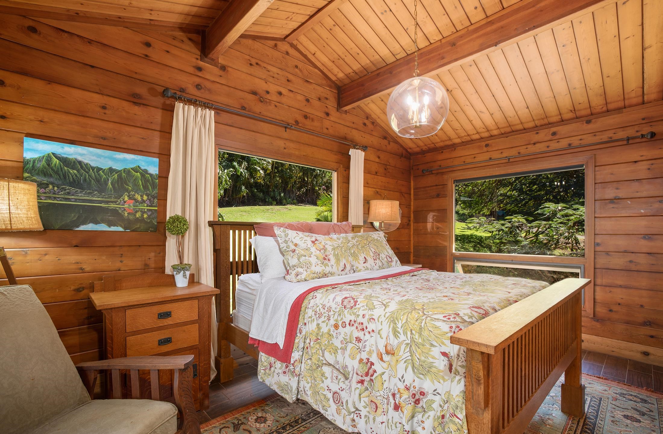 30 Mamao Place Haiku, HI 96708 - Photo 16 of 50 a bedroom with a bed and large windows
