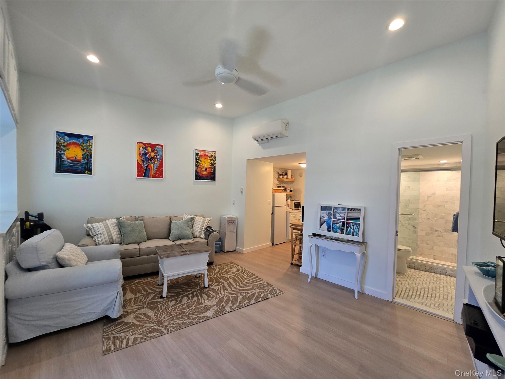 585 Dune Road, Unit L10 Westhampton, NY 11978 - Photo 12 of 25 Open living area featuring light wood-finish flooring, recessed lighting, and a ceiling fan