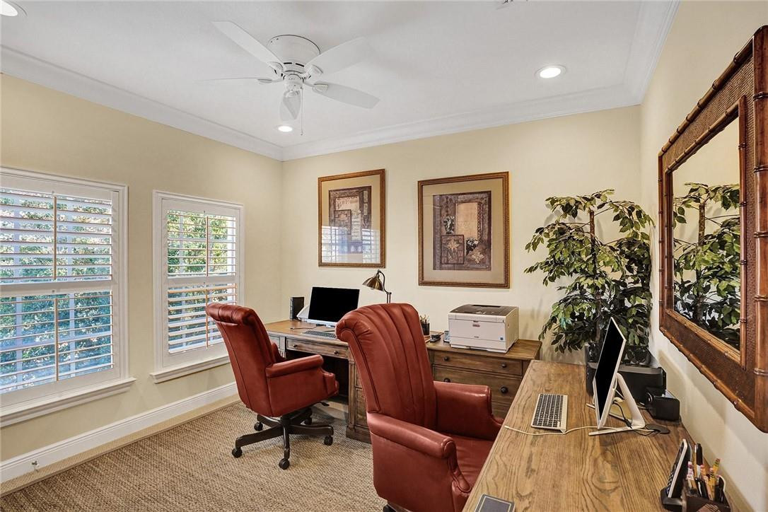 5565 Northeast Trieste Way, Unit 5565 Boca Raton, FL 33487 - Photo 31 of 44 a living room with furniture and a large window