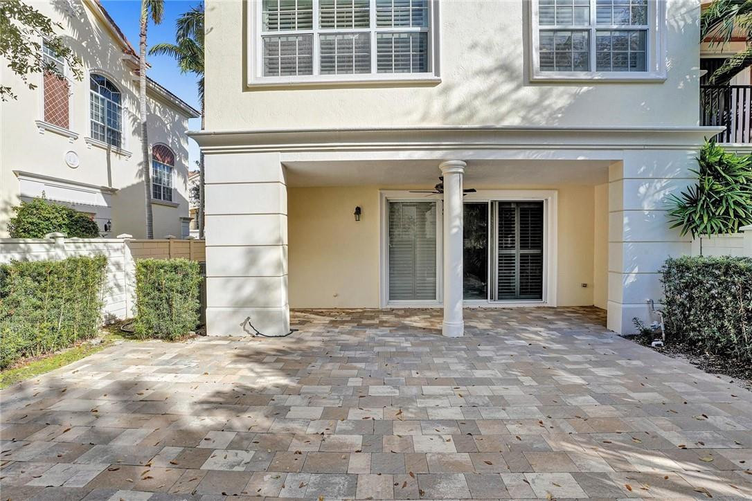 5565 Northeast Trieste Way, Unit 5565 Boca Raton, FL 33487 - Photo 34 of 44 a view of a building with an outdoor space