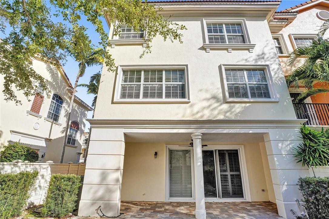 5565 Northeast Trieste Way, Unit 5565 Boca Raton, FL 33487 - Photo 35 of 44 a front view of a building