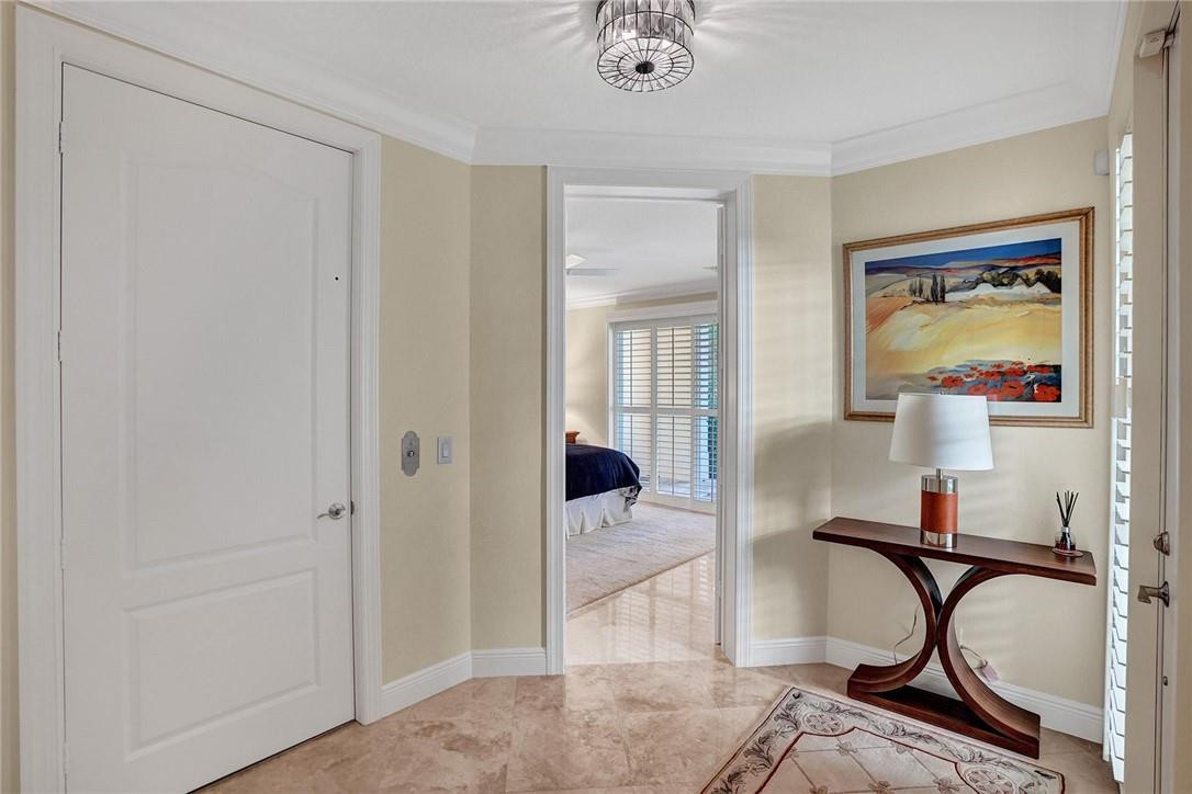 5565 Northeast Trieste Way, Unit 5565 Boca Raton, FL 33487 - Photo 6 of 44 a view of a room with gym equipment