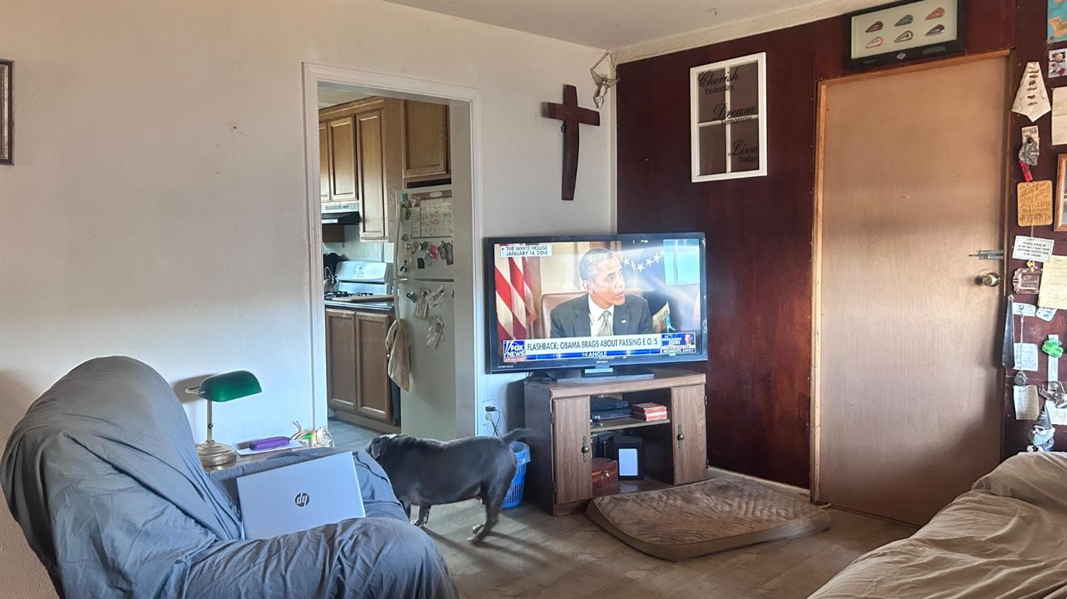 8186 Ave A Mountain Ranch, CA 95246 - Photo 3 of 8 a living room with furniture and a fireplace