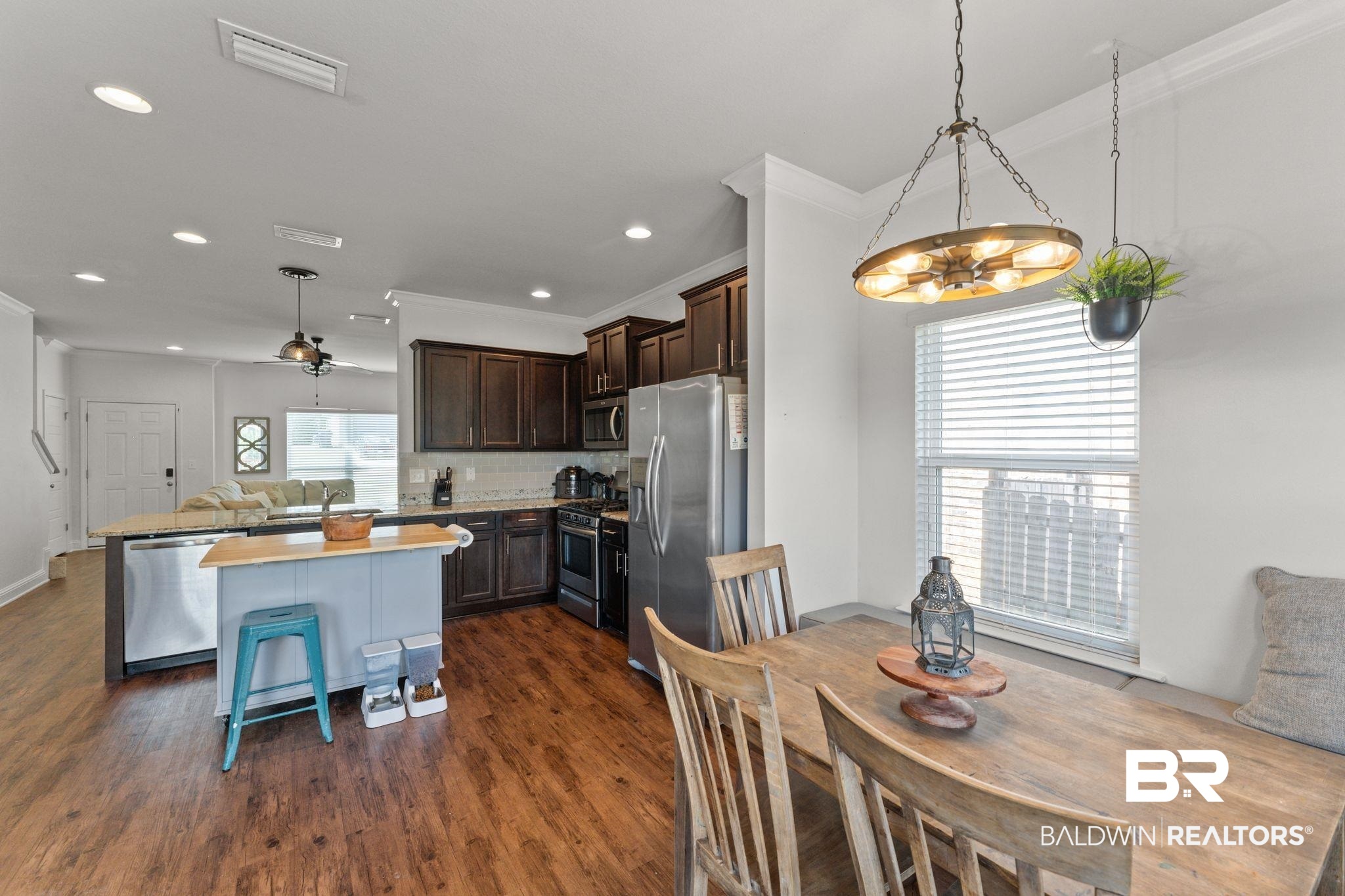 12711 Chickadee Lane Daphne, AL 36527 - Photo 14 of 39 Dining room featuring dark wood-type flooring, healthy amount of natural light, ornamental molding, recessed lighting, and a ceiling fan