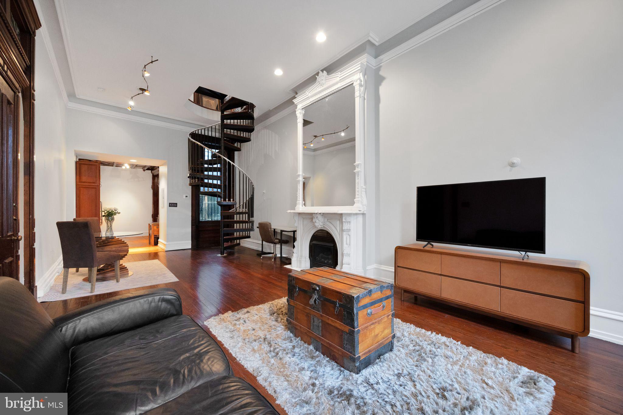 1717 Spring Garden Street, Unit A Philadelphia, PA 19130 - Photo 11 of 35 a living room with furniture and a flat screen tv