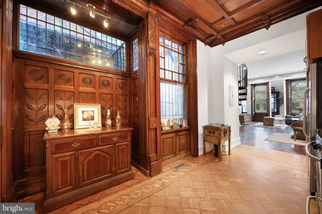 a view of a lobby with furniture and floor to ceiling window