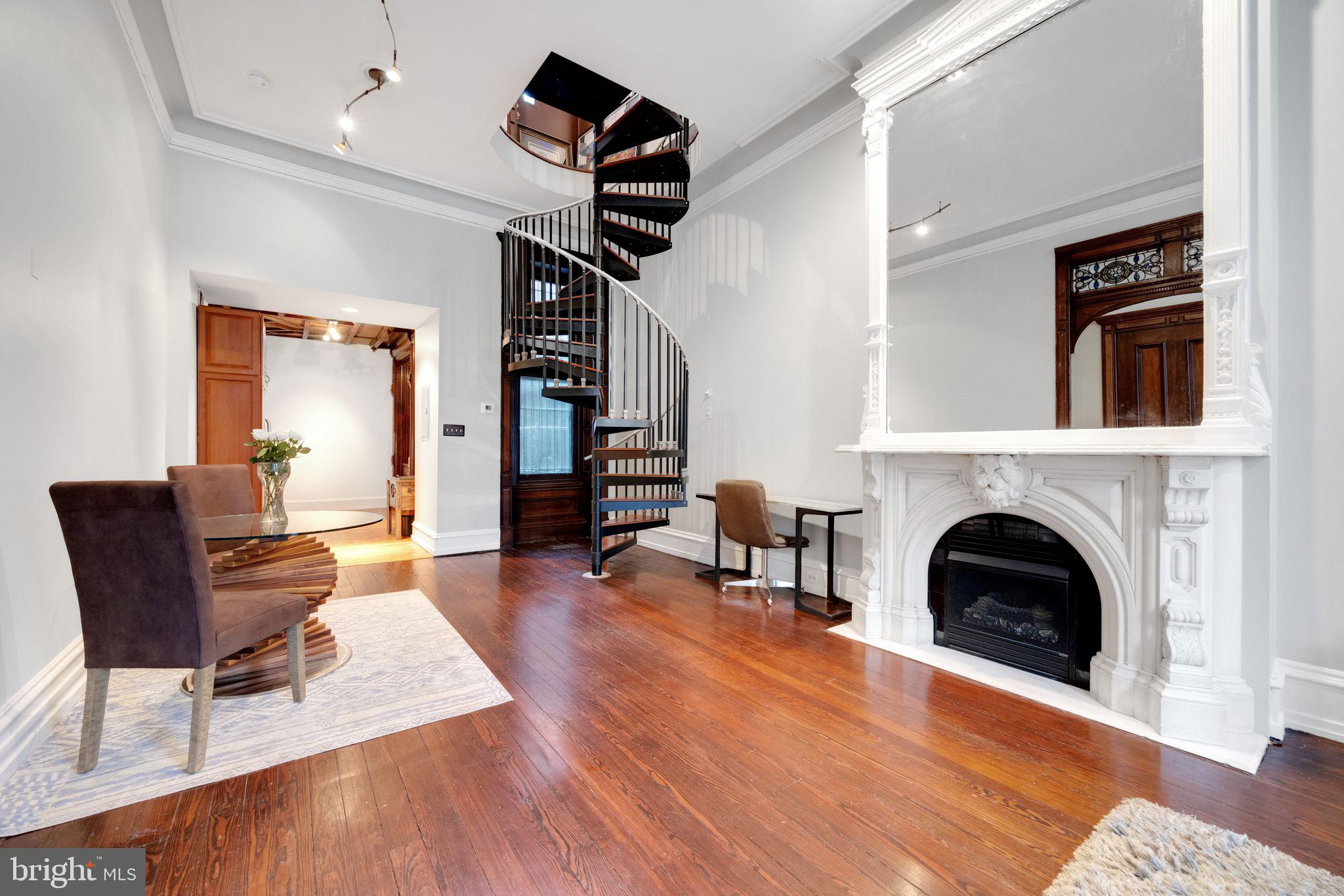 1717 Spring Garden Street, Unit A Philadelphia, PA 19130 - Photo 7 of 35 a living room with furniture and a fireplace