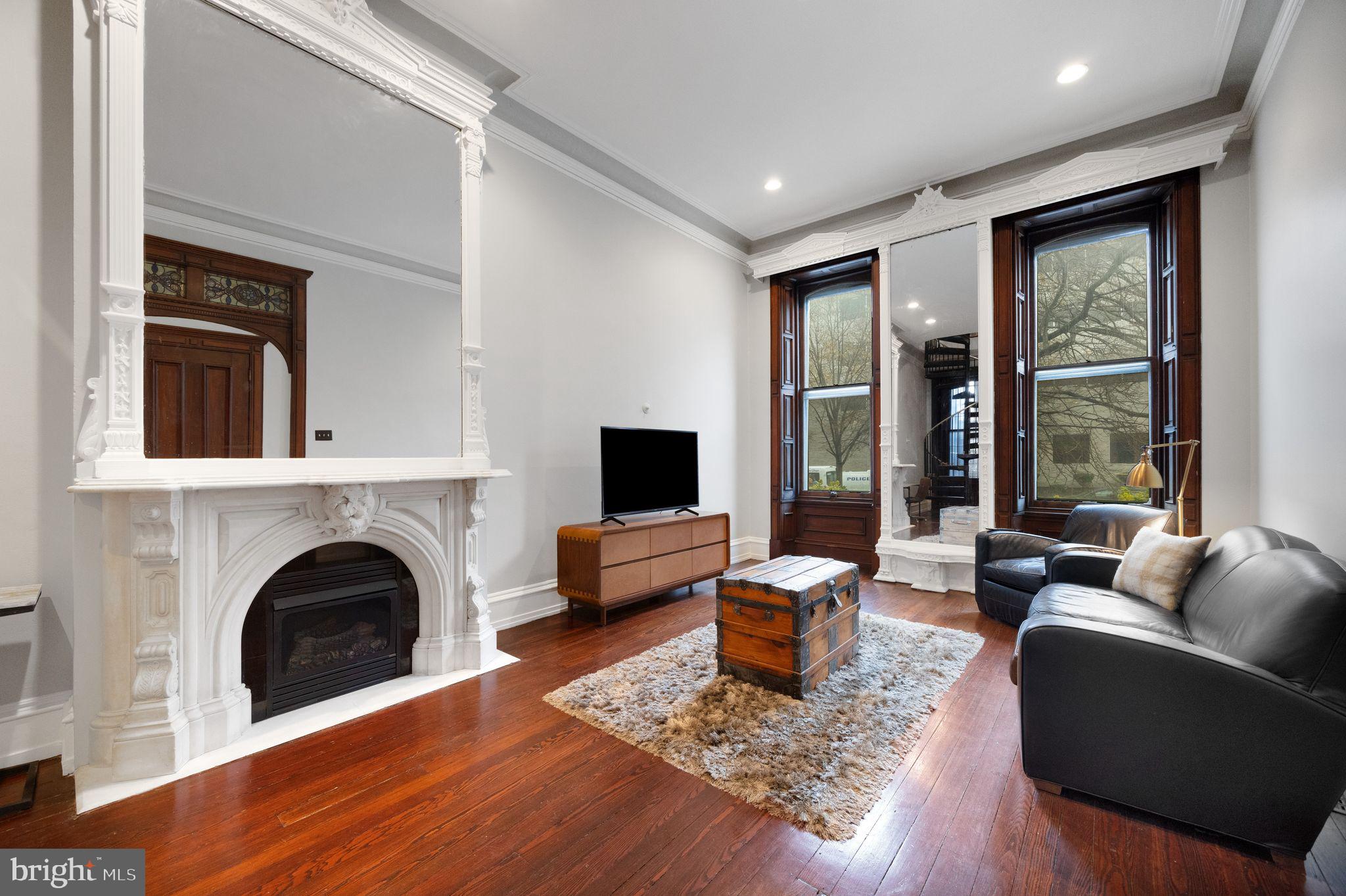 1717 Spring Garden Street, Unit A Philadelphia, PA 19130 - Photo 9 of 35 a living room with furniture and a fireplace