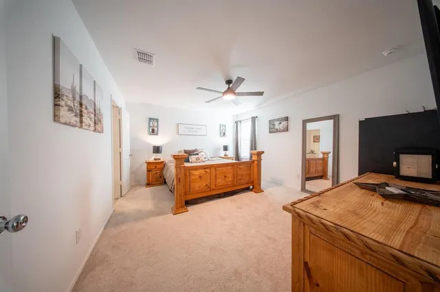 a bedroom with furniture and a chandelier