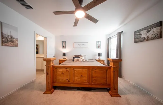 a bed room with a bed and a chandelier