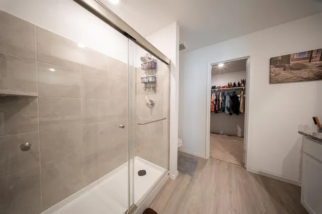 a bathroom with a bathtub and shower