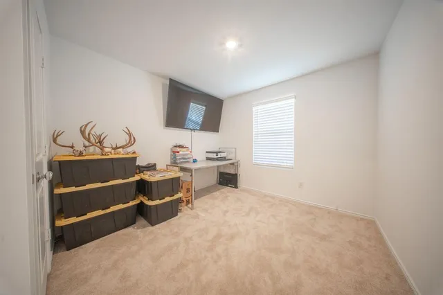 a room with a bed and a window