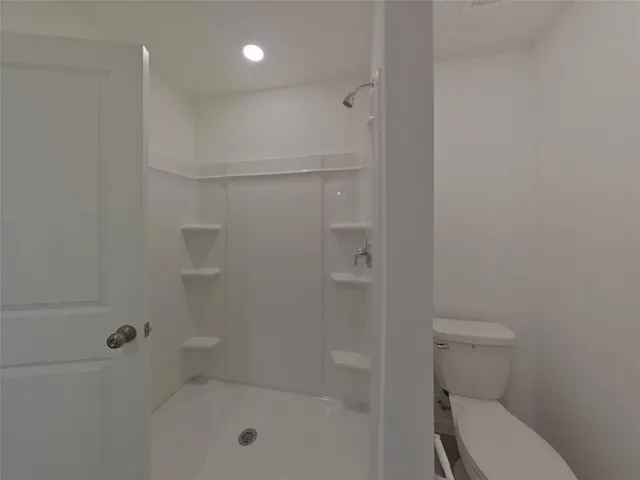 a backyard of a house with lots of green space and plants