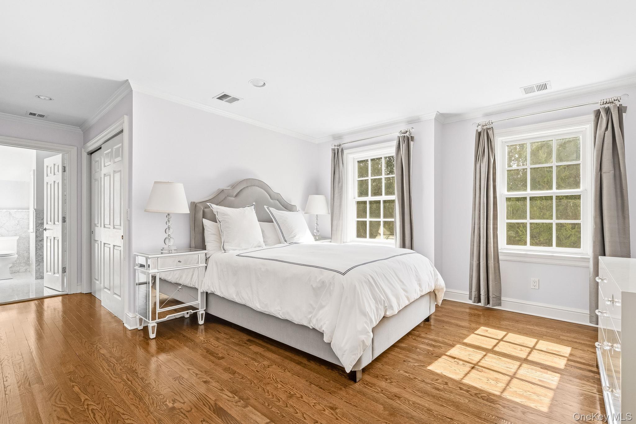 58 Old Logging Road Bedford, NY 10506 - Photo 23 of 34 a bedroom with a bed and a large window