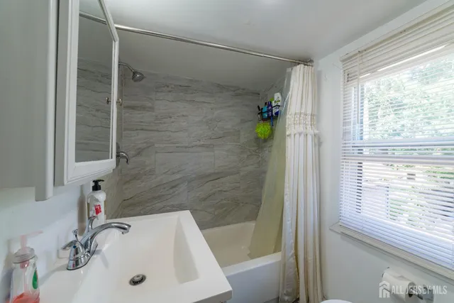 a bathroom with a sink and a tub