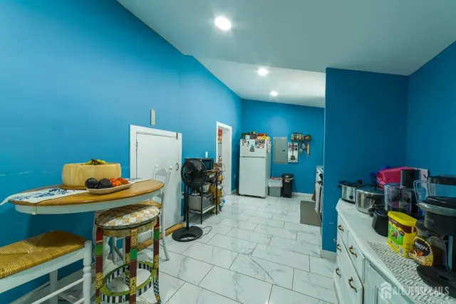 a room with furniture and gym equipment