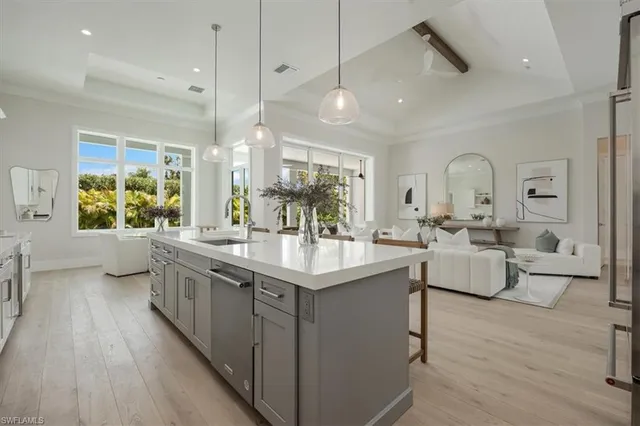 a bathroom with sink a mirror and a bathtub