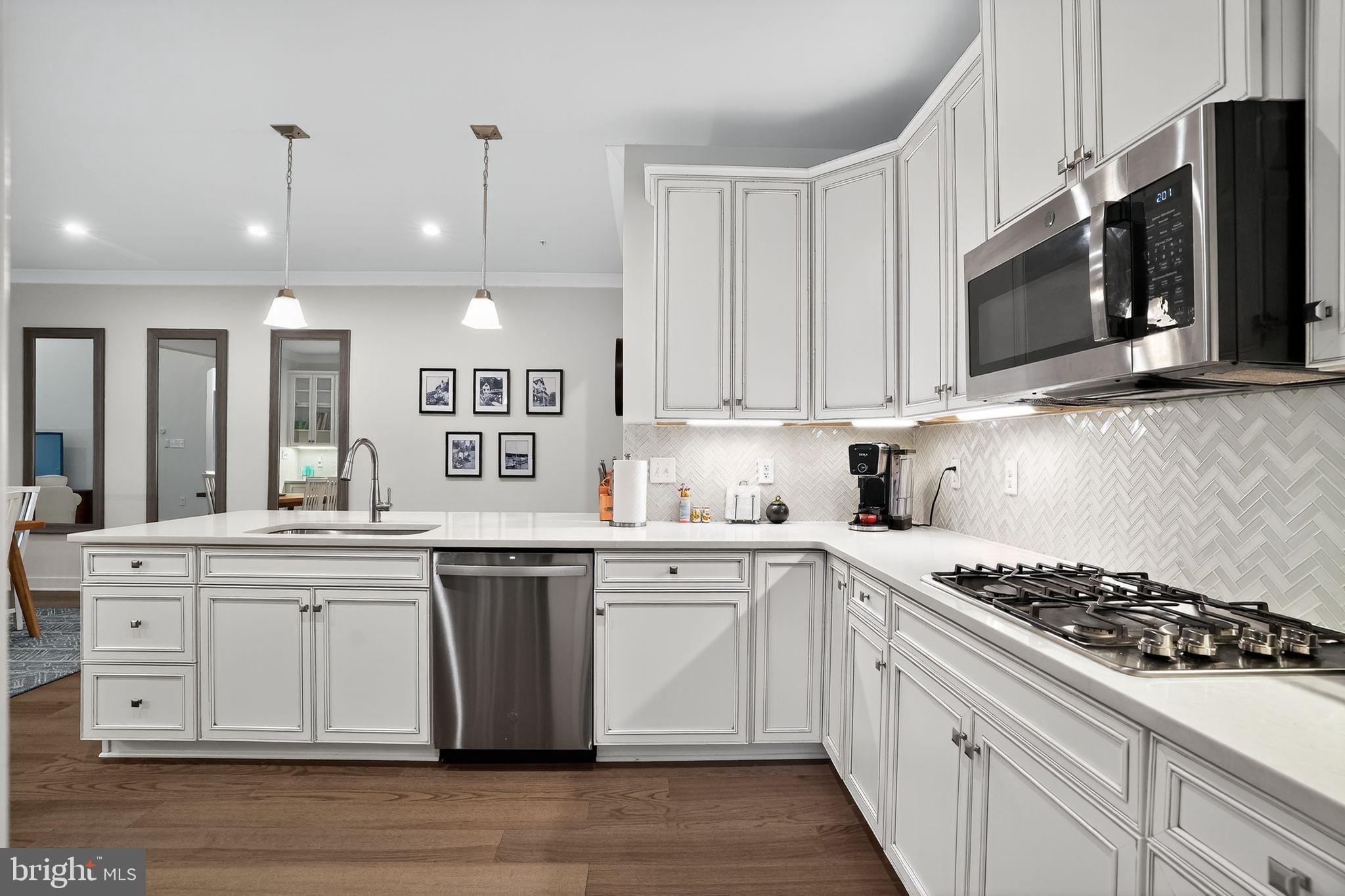 701 Cascade Way Kennett Square, PA 19348 - Photo 14 of 46 a kitchen with stainless steel appliances granite countertop a stove and a sink