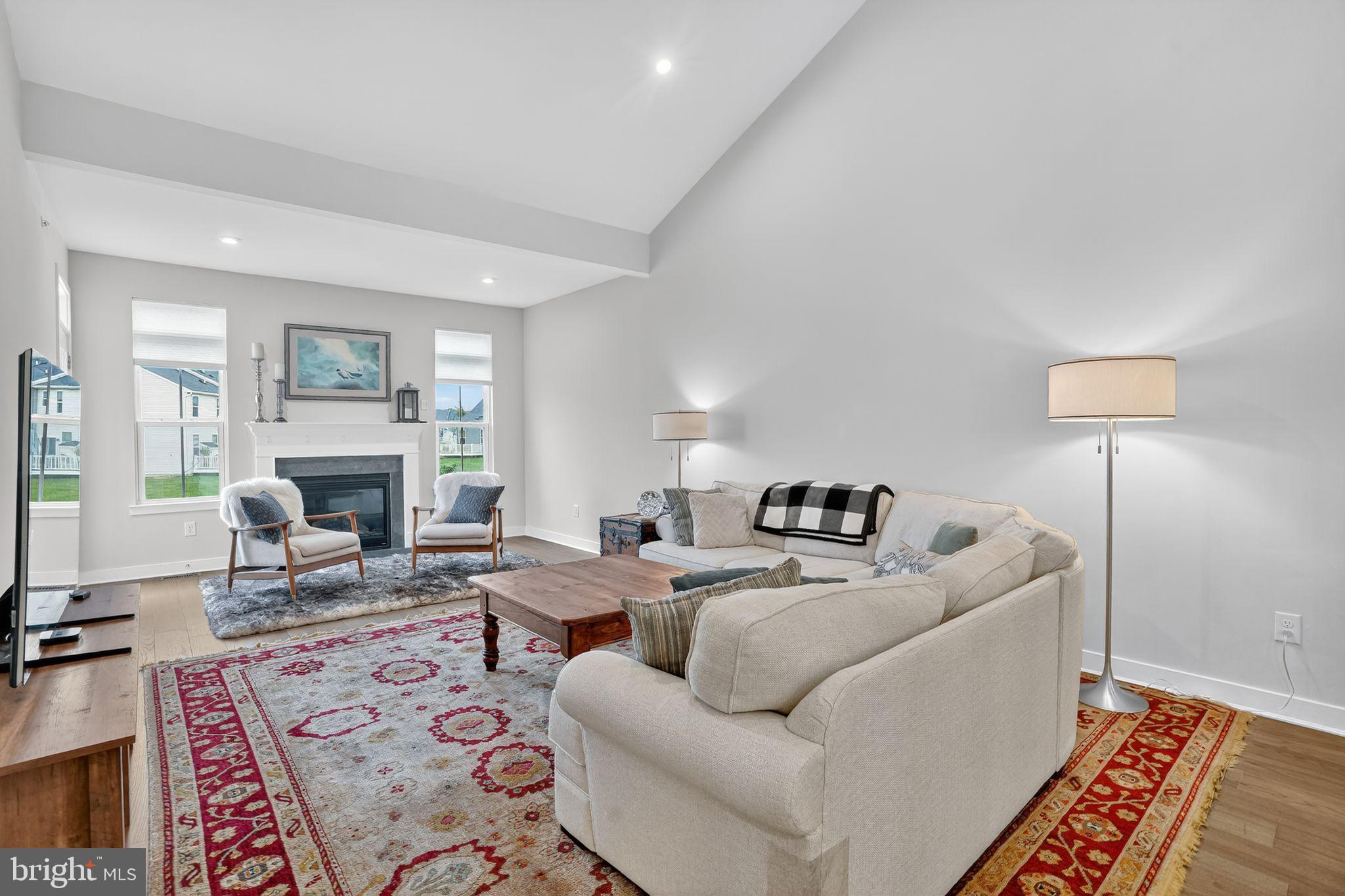 701 Cascade Way Kennett Square, PA 19348 - Photo 17 of 46 a living room with furniture a fireplace and a table