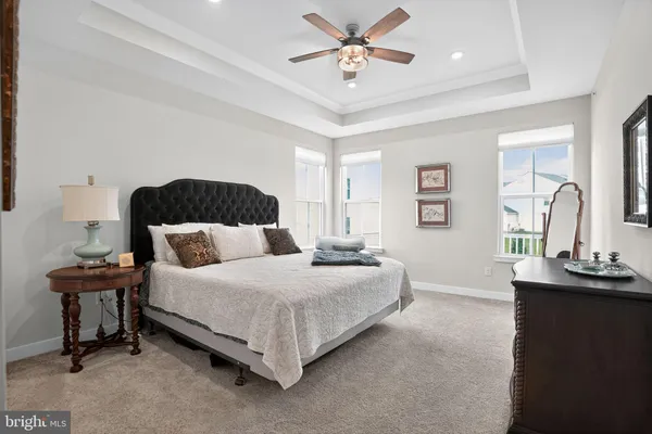 a bedroom with a bed and a table
