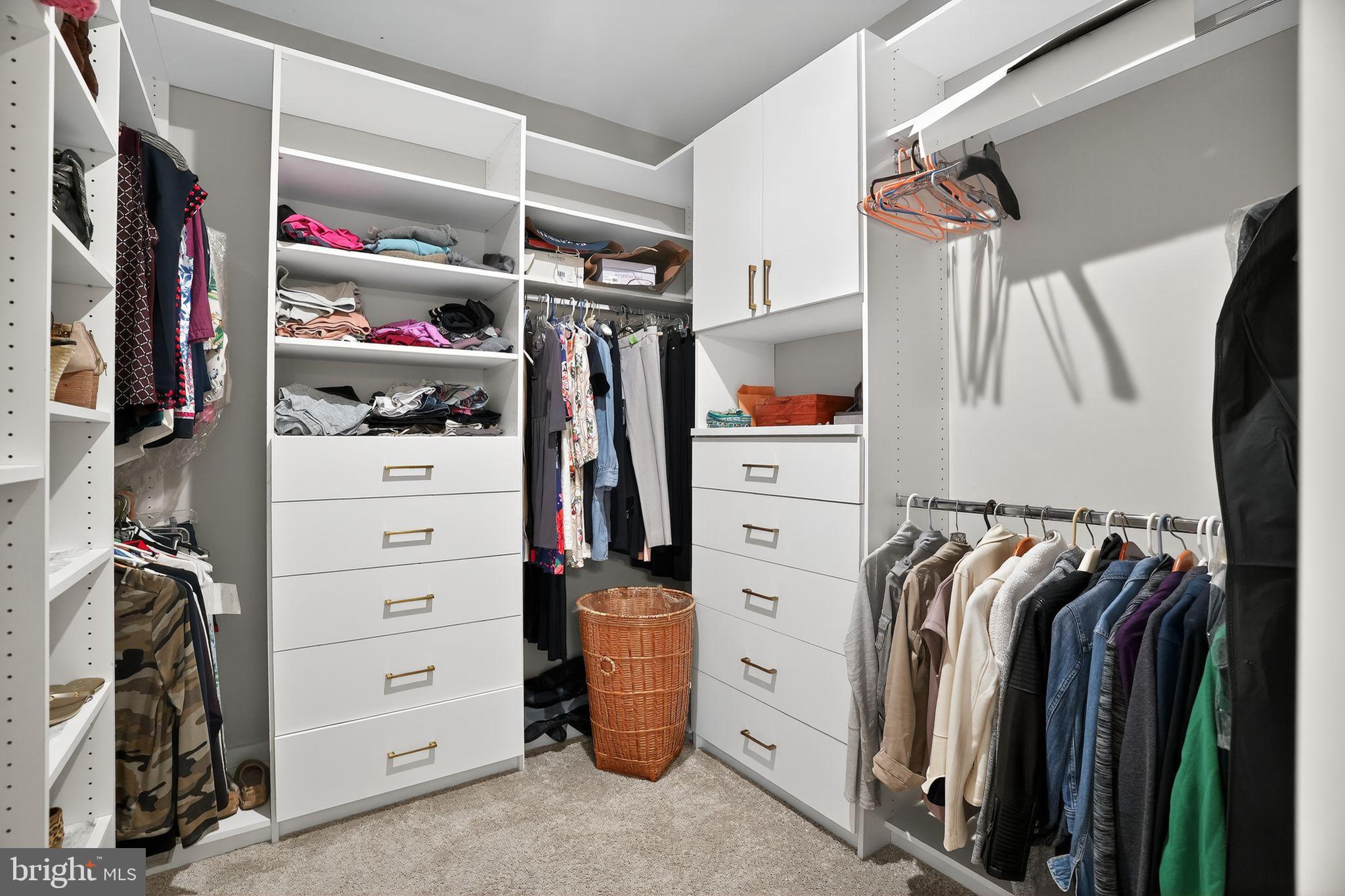 701 Cascade Way Kennett Square, PA 19348 - Photo 27 of 46 a view of walk in closet with clothes and shoes