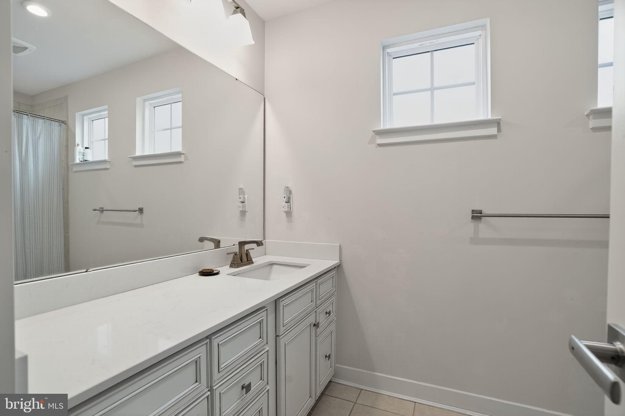 701 Cascade Way Kennett Square, PA 19348 - Photo 33 of 46 a bathroom with a sink a vanity and a mirror