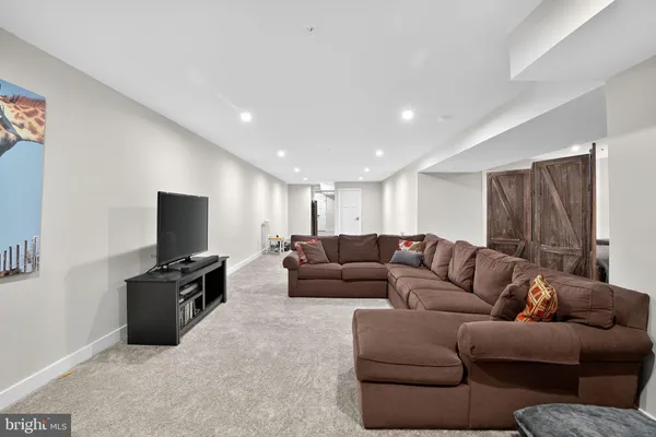 a living room with furniture and a couch