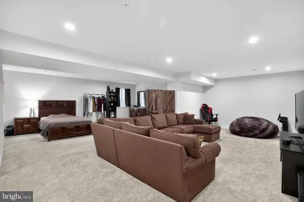 a view of a room with an empty space and a window