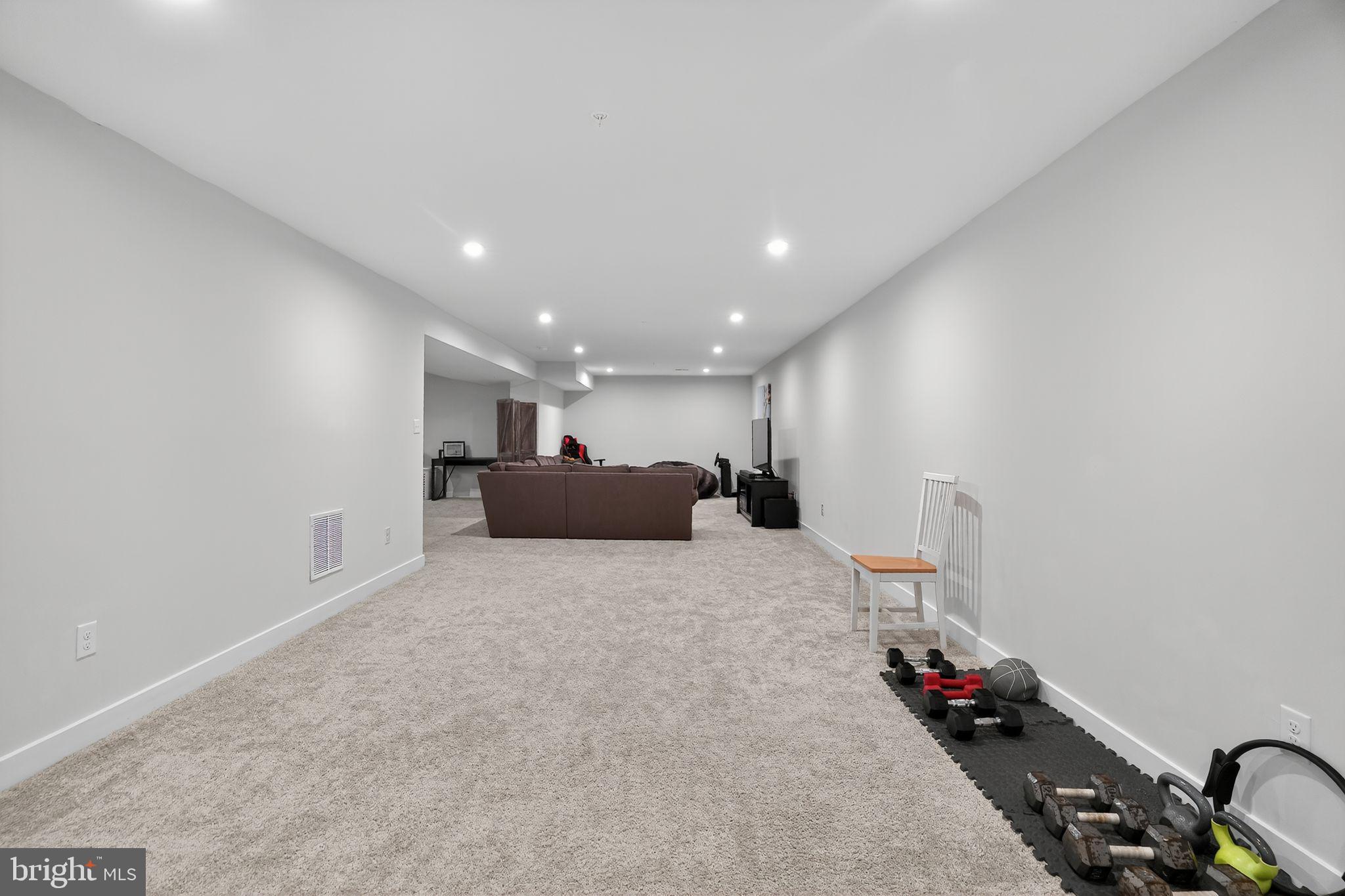 701 Cascade Way Kennett Square, PA 19348 - Photo 38 of 46 a large bedroom with a bed and a chandelier