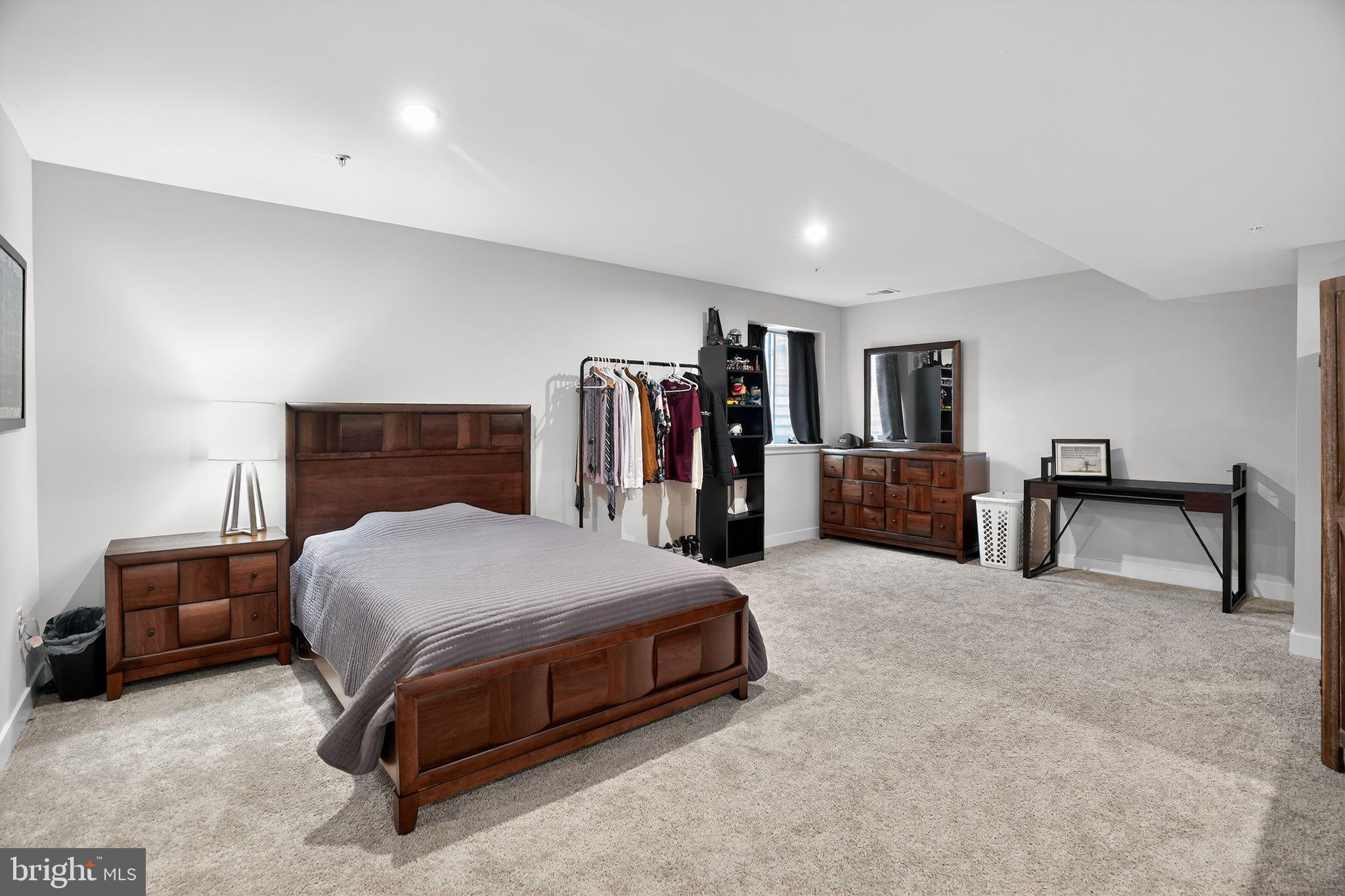 701 Cascade Way Kennett Square, PA 19348 - Photo 39 of 46 a spacious bedroom with a bed and a dresser