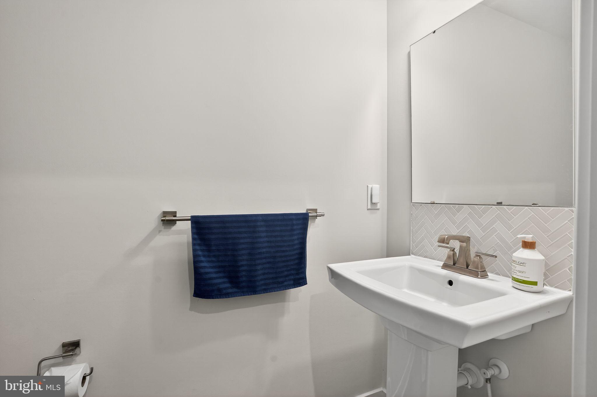 701 Cascade Way Kennett Square, PA 19348 - Photo 40 of 46 a bathroom with a sink and a mirror