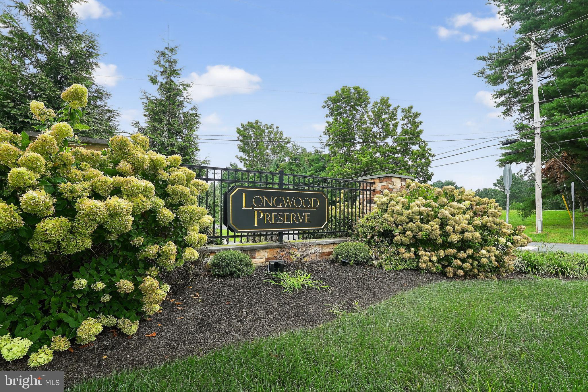 701 Cascade Way Kennett Square, PA 19348 - Photo 6 of 46 a sign of golf club on a wall under a tree