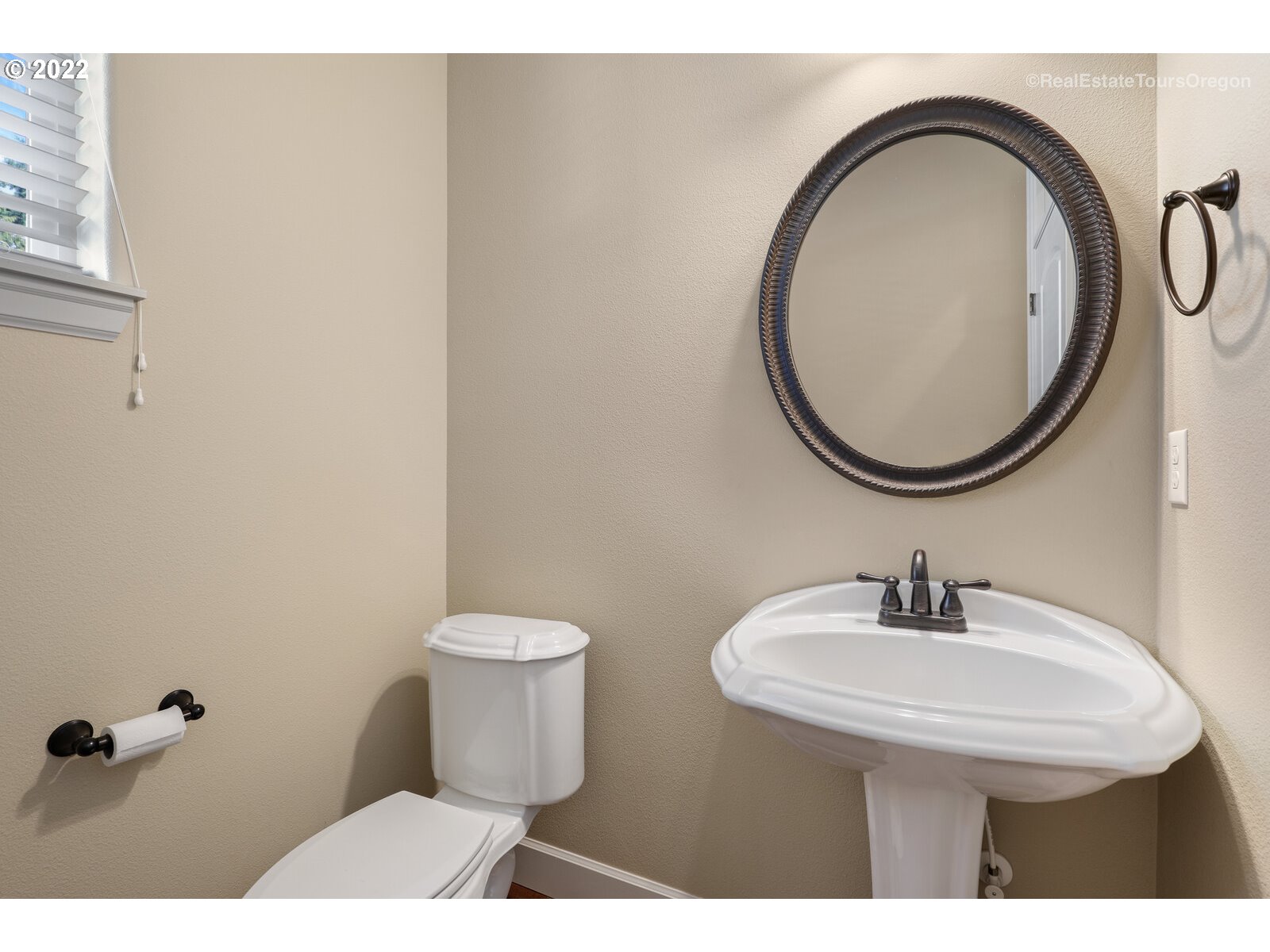 11510 Northwest Knightsview Lane Portland, OR 97229 - Photo 14 of 32 a bathroom with a sink a toilet and a mirror