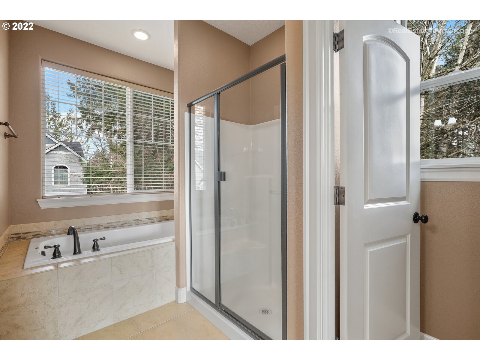 11510 Northwest Knightsview Lane Portland, OR 97229 - Photo 18 of 32 a bathroom with a bathtub and a sink