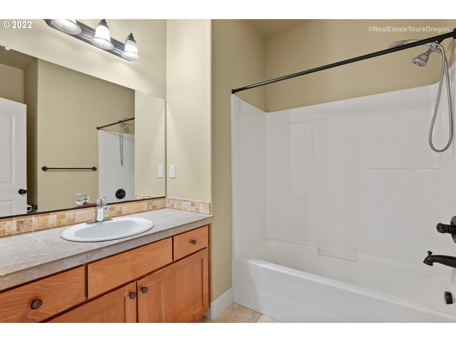 11510 Northwest Knightsview Lane Portland, OR 97229 - Photo 22 of 32 a bathroom with a sink and a mirror