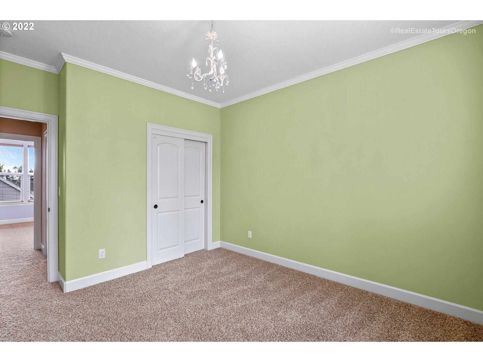 11510 Northwest Knightsview Lane Portland, OR 97229 - Photo 24 of 32 a view of an empty room with a chandelier fan
