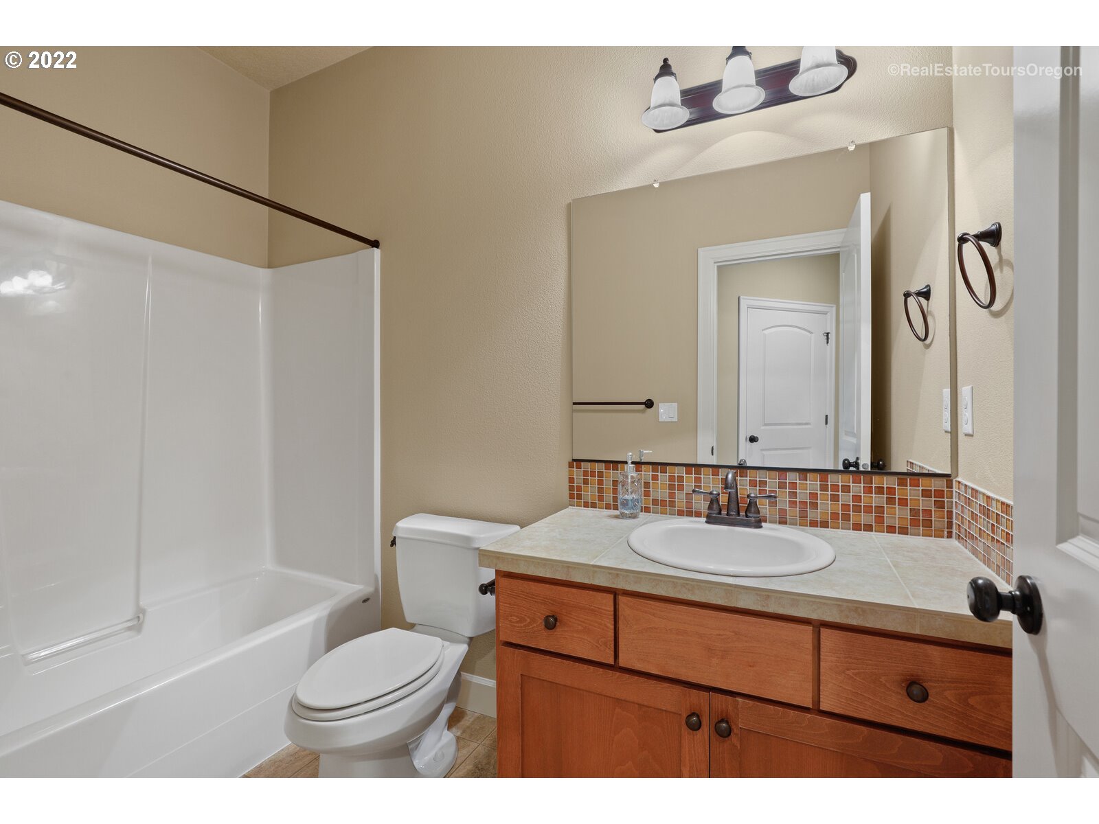11510 Northwest Knightsview Lane Portland, OR 97229 - Photo 27 of 32 a bathroom with a sink and a mirror